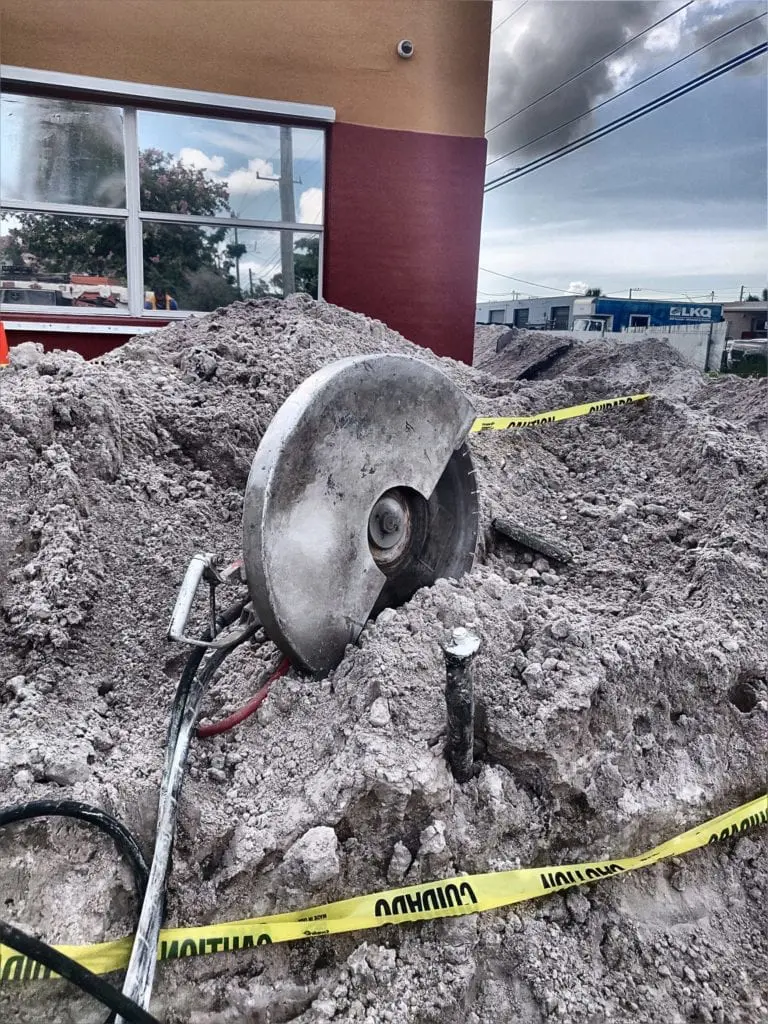 hand saw sitting in dirt