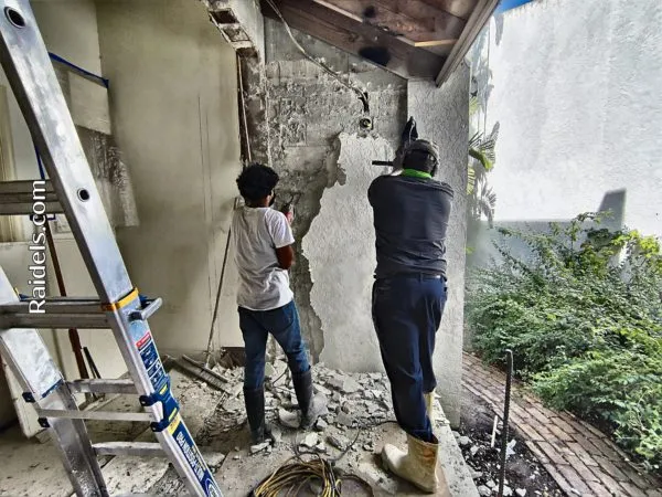 We Need To Be Flush With The Existing Block Wall So The Guys Are Chipping About 3/4 Inch Of Stucco.